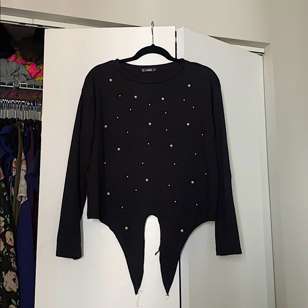 Long sleeve black top with pearl and tie details